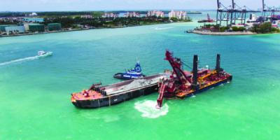 Great Lakes Dredge & Dock's Mechanical Backhoe Dredge New York Loads a Scow During the Miami Harbor Deepening Project